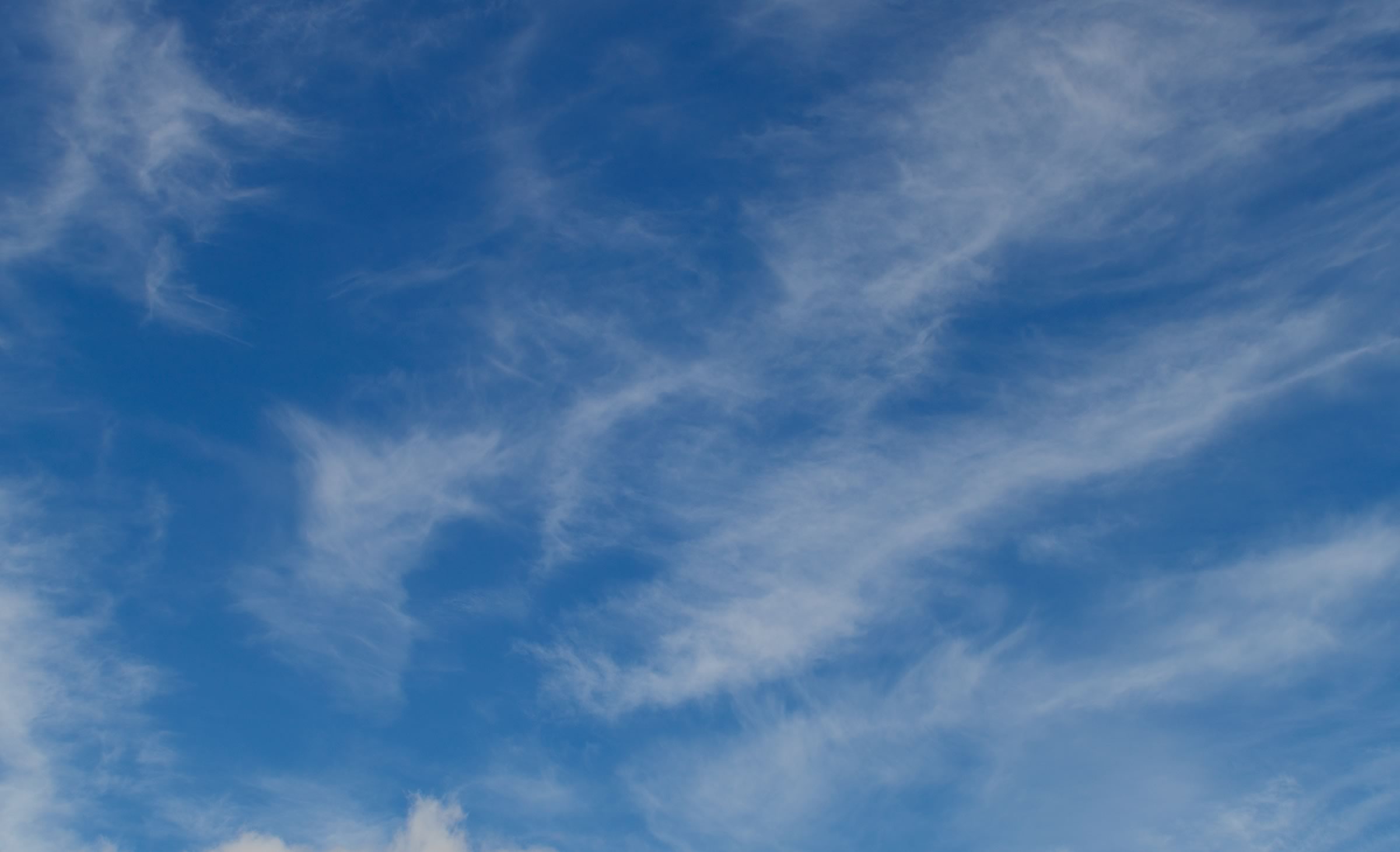 Photo of a blue sky with clouds.