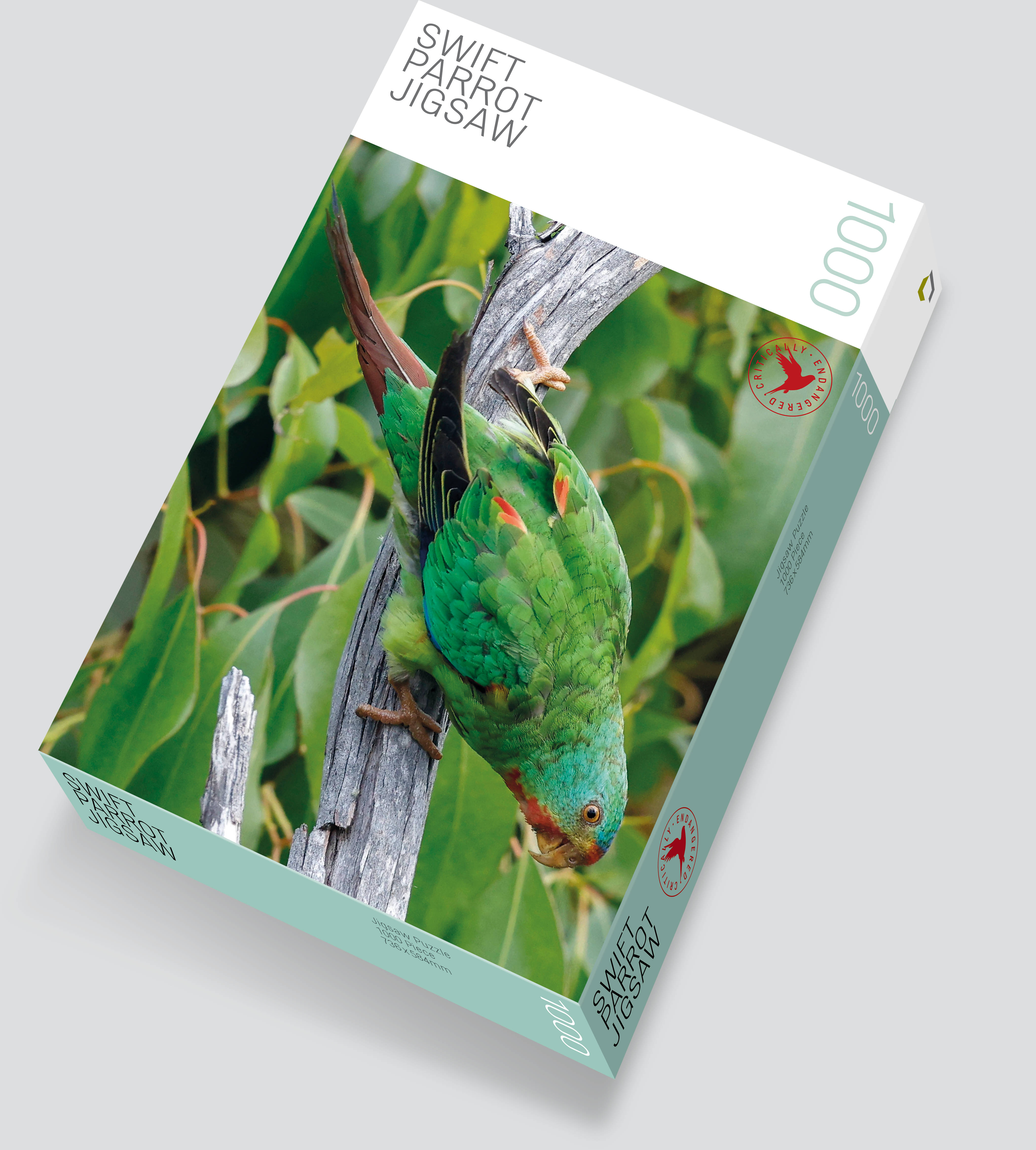 A picture of the Swift Parrot jigsaw box, with a Swift Parrot amongst dense eucalyptus foliage. There is a red circle with a red Swift Parrot silhouette and red text reading Critically Endangered. Image by Rob Blakers.
