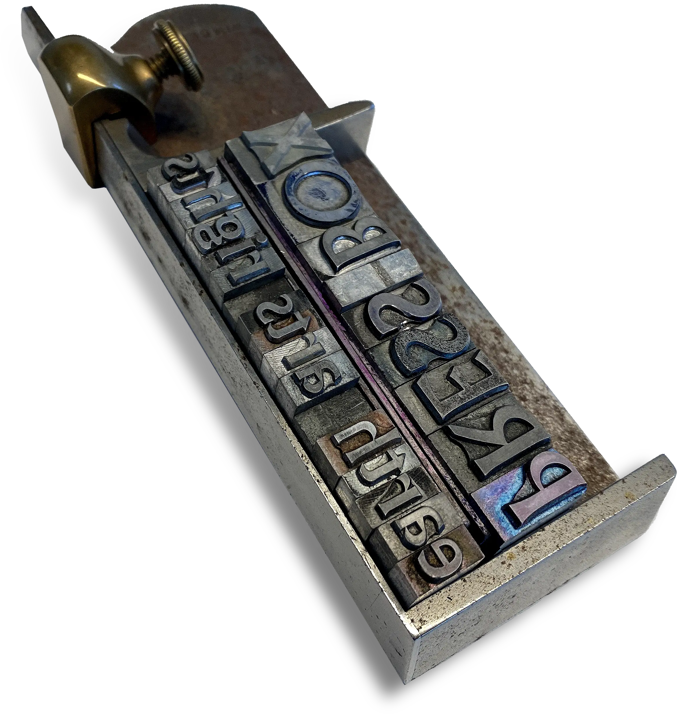 A close up image of a type rack holding capital letter metal type spelling PRESS BOX and lowercase letter type spelling earth arts rights. The type is in mirror reverse.