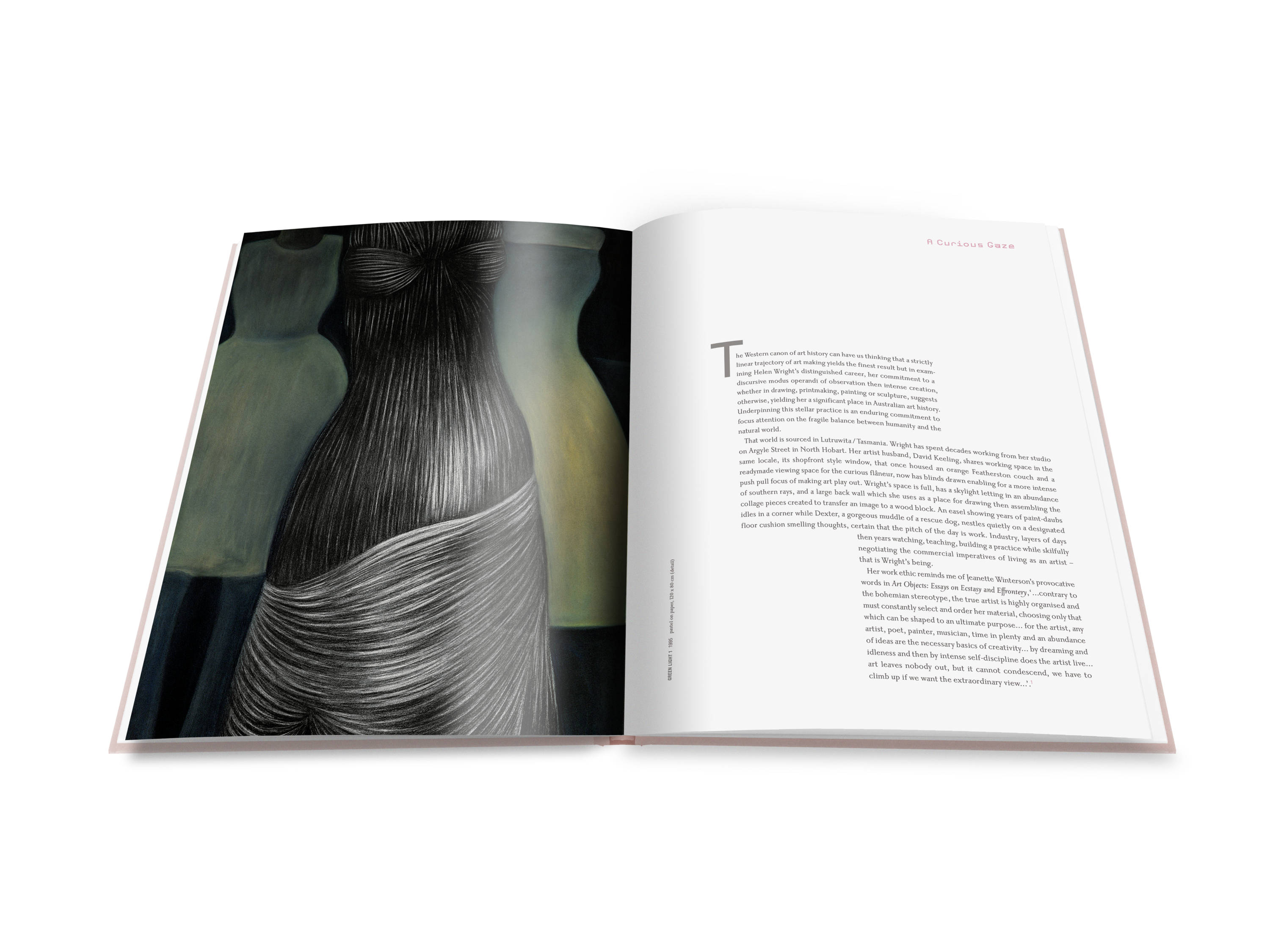 A double page spread from Shapeshifting : Helen Wright with text from the essay titled ‘A Curious Gaze’, and illustrated with a large green, yellow and black pastel artwork of a woman’s torso wrapped in human hair alongside two dressmakers mannequins.