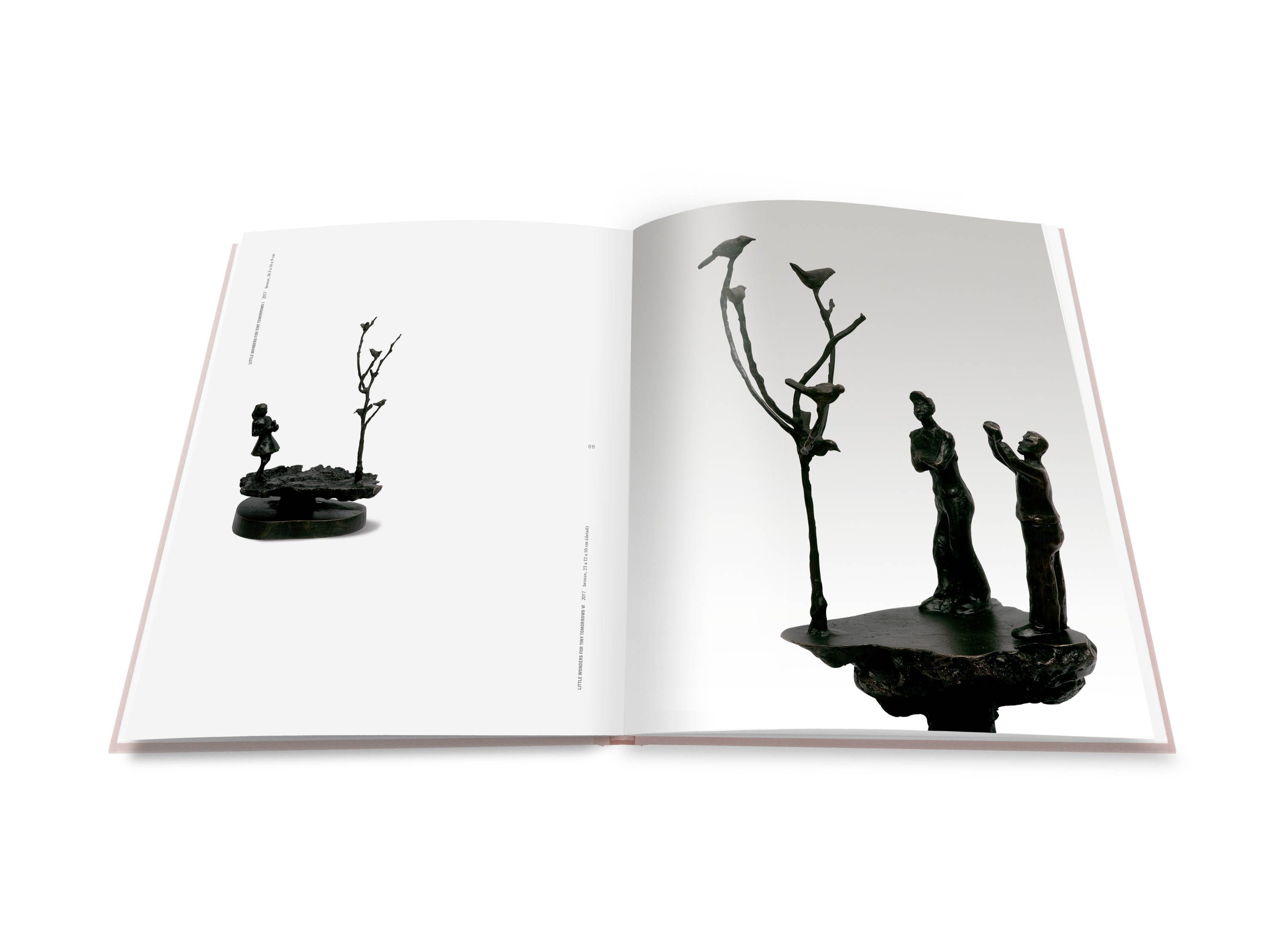A double page spread from Shapeshifting : Helen Wright with two bronze sculptures. One sculpture has a little girl holding a bird looking up at a dead tree which has four birds perched on the bare branches. The other is of two figures photographing a dead tree which has five birds perched on the bare branches.