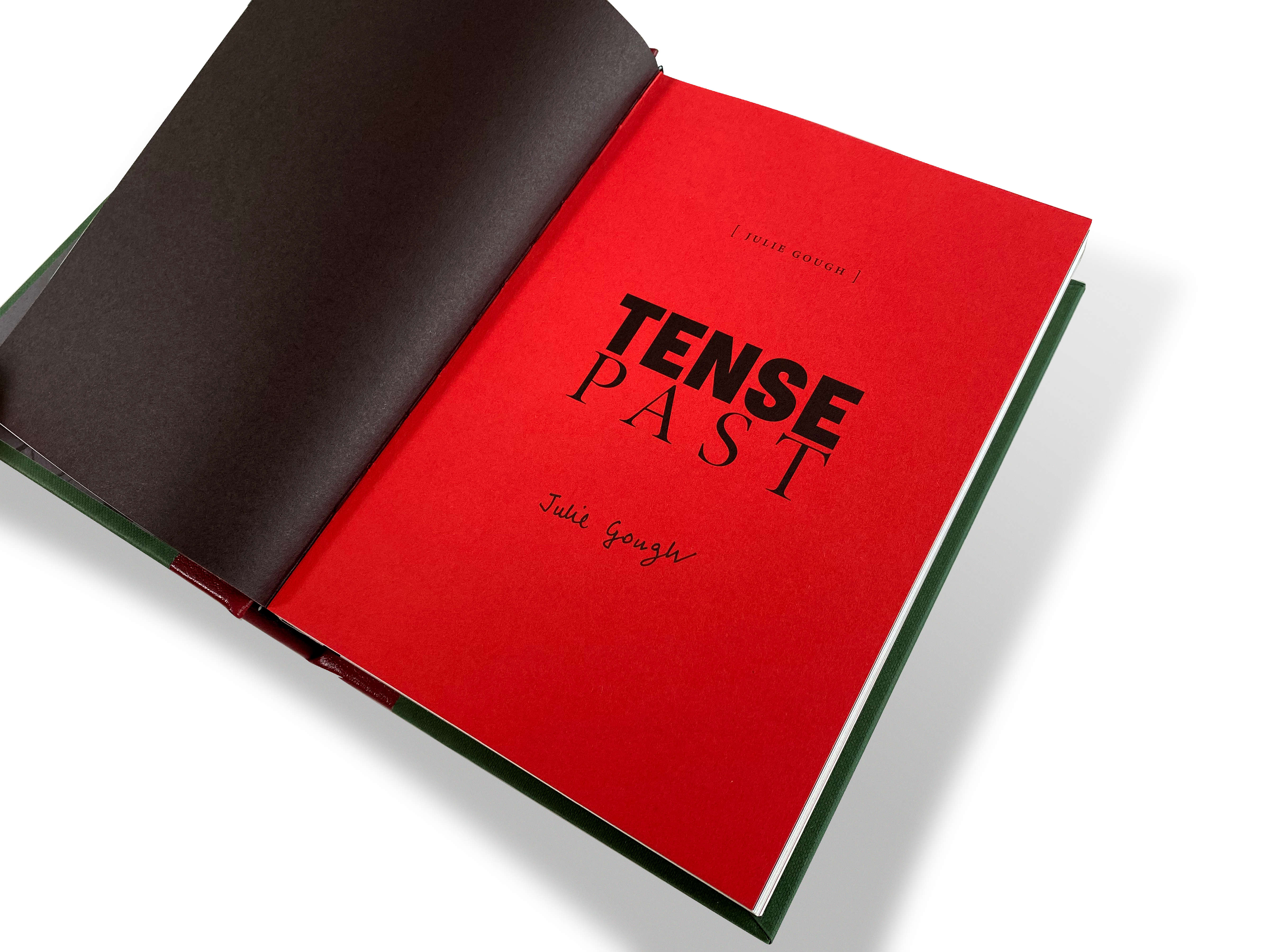 An image of the TENSE PAST book open at the Title Page showing Julie Gough’s signature.