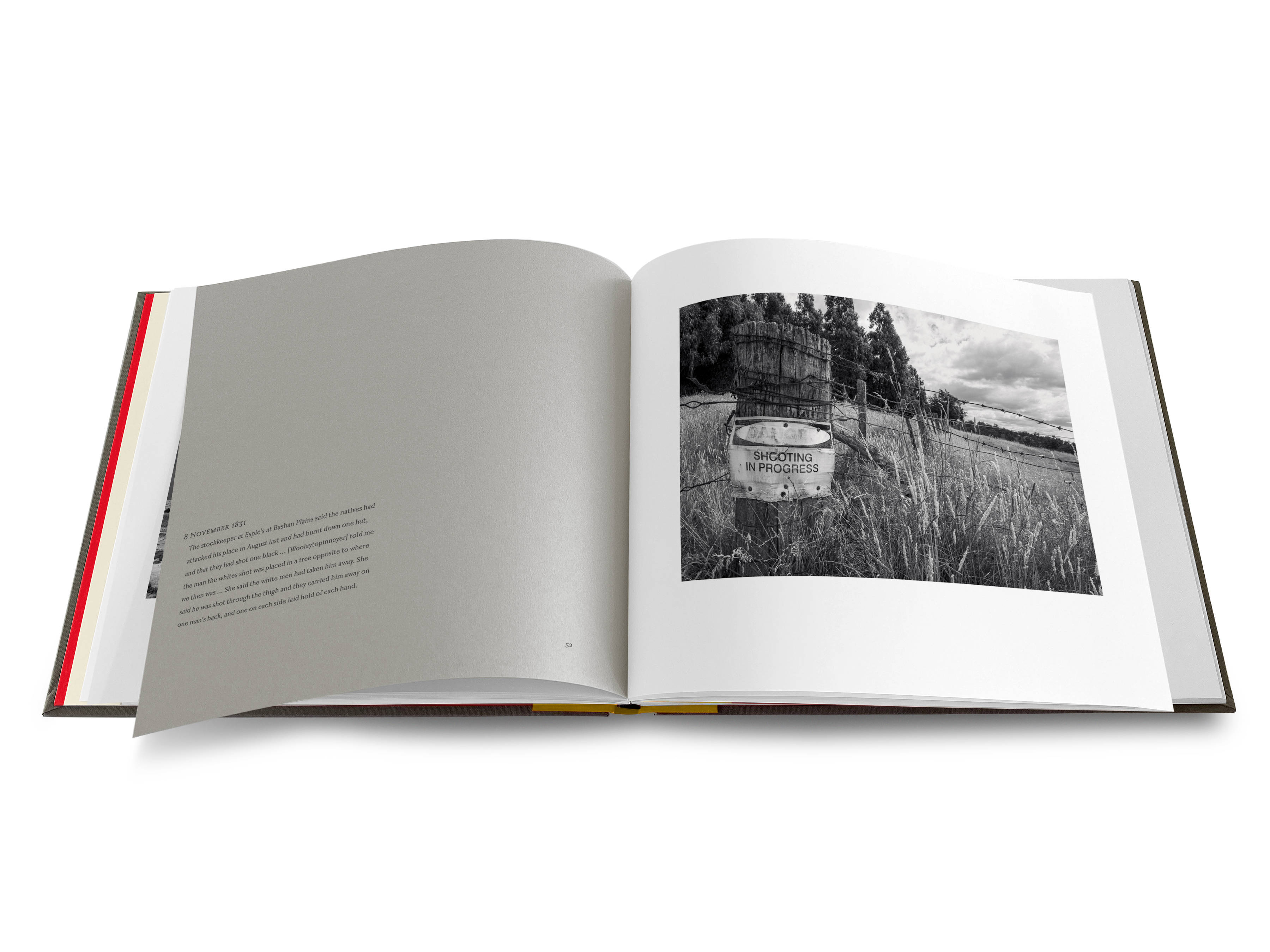 An image of a double-page spread from the Uninnocent Landscapes book with an image on the right of a corner barbed-wire fence post in a field with a sign that reads ‘DANGER SHOOTING IN PROGRESS’. There is a row of pine trees in the background. On the left there is a quote from Robinson’s diary on a grey page.