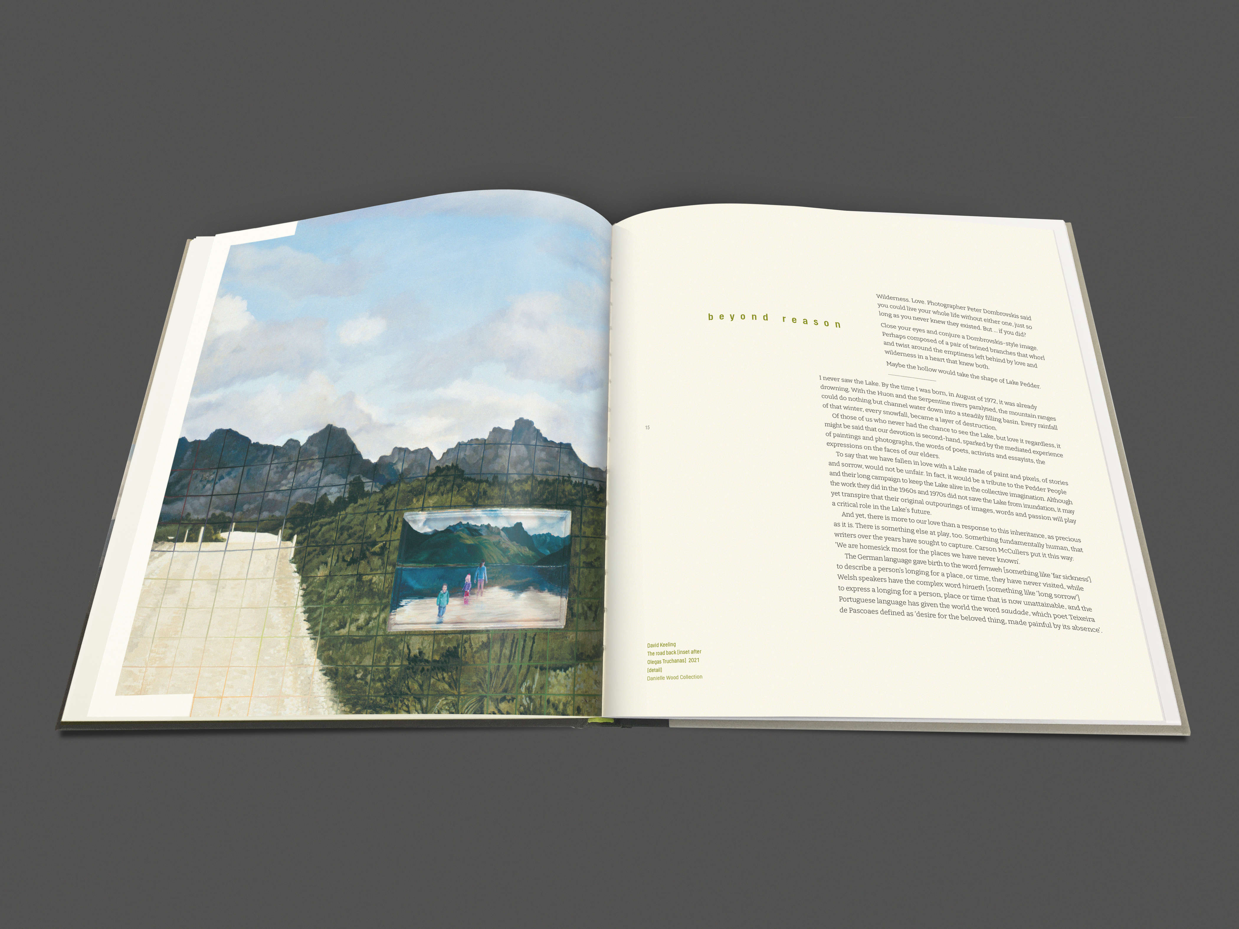 Image of a double-page spread from the water[shed] exhibition publication (pages 14 & 15). The left-hand page features a detail from the oil painting by David Keeling titled, ‘The road back (inset after Olegas Truchanas)’ (2021). The painting shows a section of the unsealed Scotts Peak Road with a topographic map grid overlay and rugged mountain ranges in the background. A small inset image depicts three children paddling in the shallow water of the original Lake Pedder before it was flooded. The right-hand page is the first page of the essay by Danielle Wood titled ‘Beyond Reason’.